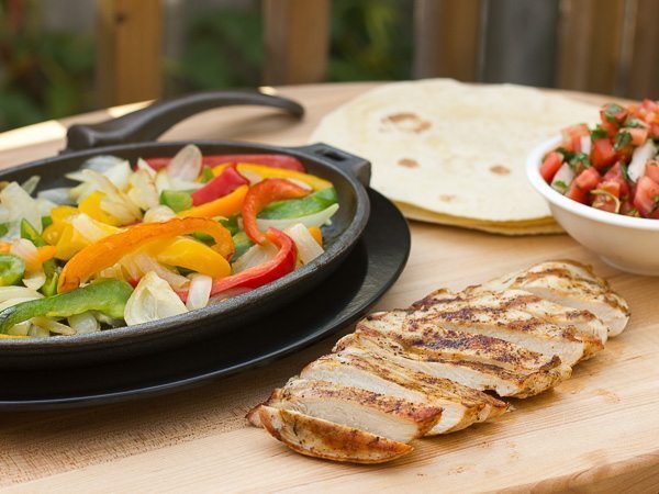 Grilled chicken and ingredients for fajitas